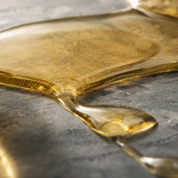 Melted gold on a textured surface