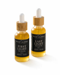 Two bottles of Wild Alaska Skincare face oils on a white background
