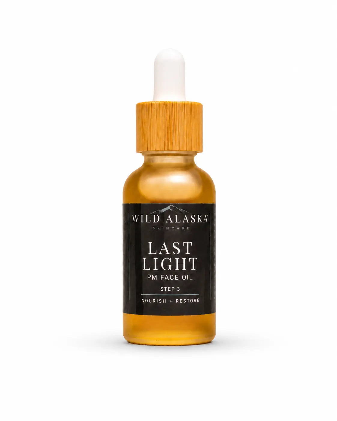 Bottle of Wild Alaska Skincare Last Light PM Face Oil on a white background