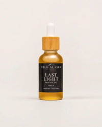 Bottle of Wild Alaska Skincare Last Light PM Face Oil on a white background