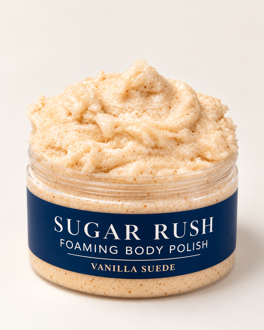 Vanilla Suede open jar: Open jar of Sugar Rush Foaming Body Polish in Vanilla Suede, showing its cream-colored, whipped, speckled texture.
