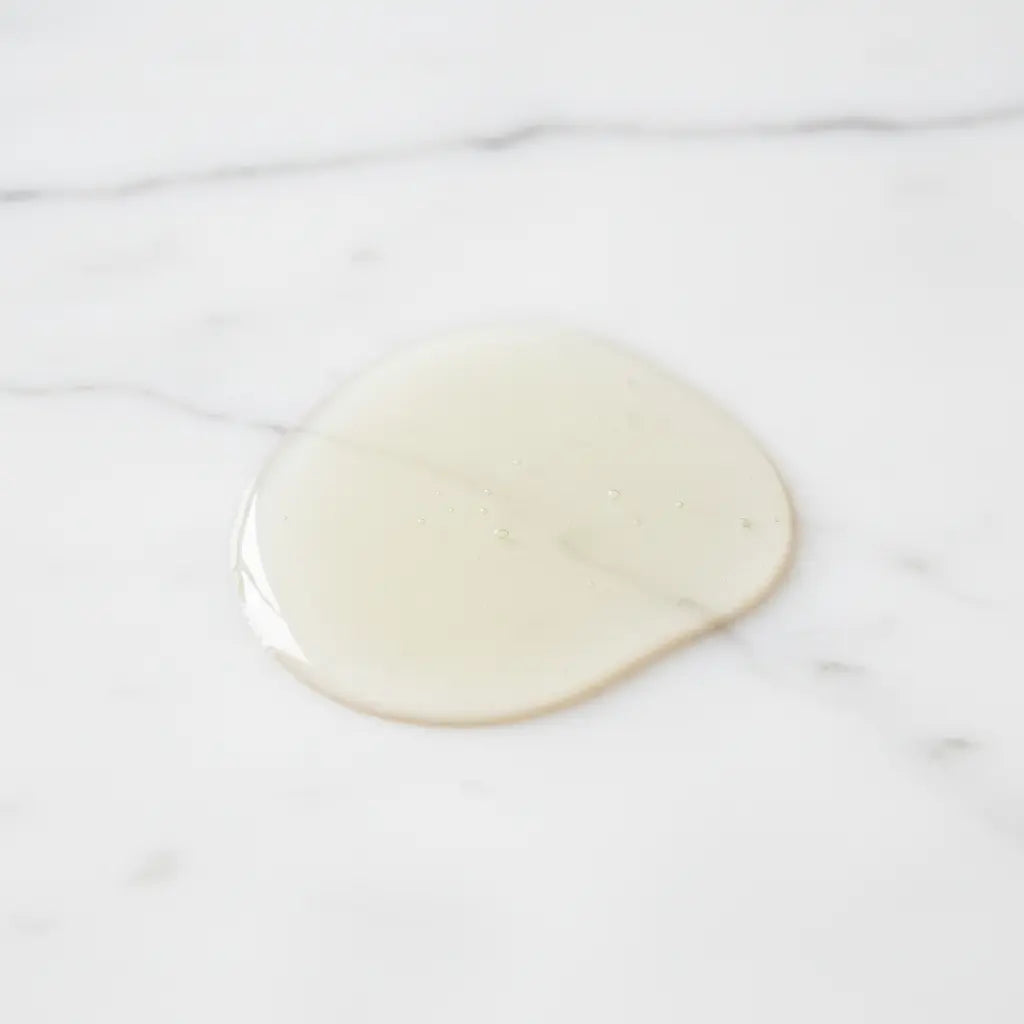 Pale Clear Oil on White Marble