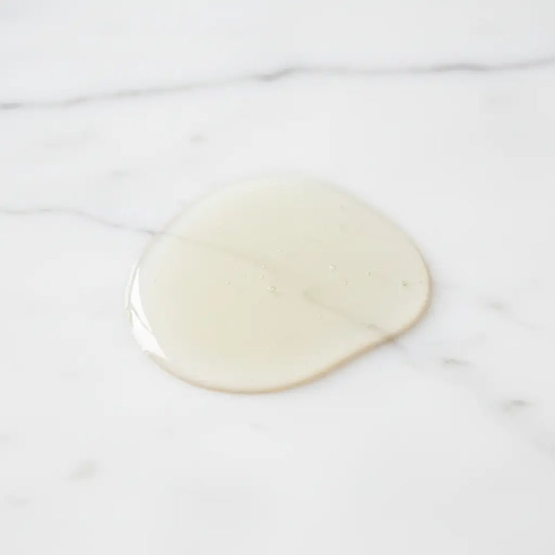 Pale Clear Oil on White Marble